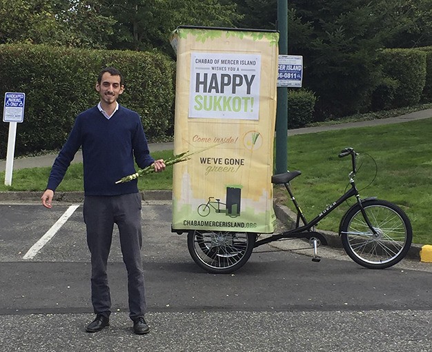 Rabbi Nissan Kornfeld of Chabad Mercer Island rode a “Pedi-Sukkah” to celebrate Sukkot.