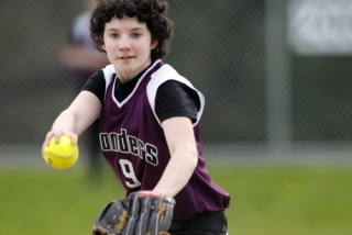 Islanders’ starting softball pitcher Charlotte Pearman throws a pitch during a game at Bellevue on April 7. The young team lost to the Wolverines