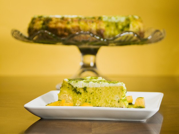 Mango cheesecake for Passover is served with lemon basil syrup.