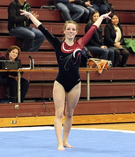 Emily Lightfoot finishes her floor routine against Liberty Dec. 12 at Mercer Island High School. Lightfoot competed in gymnastics throughout high school