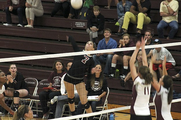 Mercer Island’s Kelly Behrbaum goes up for a spike against Holy Names Academy Friday