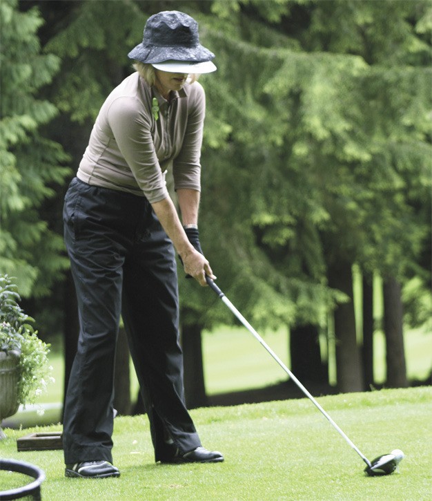 Mercer Island’s Deni Sutherland tees off during the third day of the Seattle Women’s Golf Association City Championship at Sahalee Country Club.