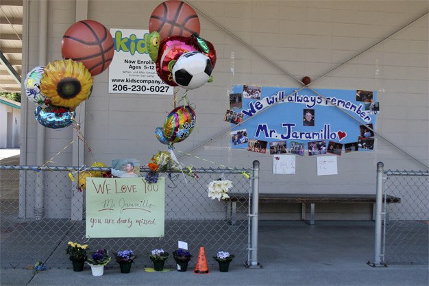 Island Park Elementary students set up a memorial for Jesse Jaramillo in front of the school.