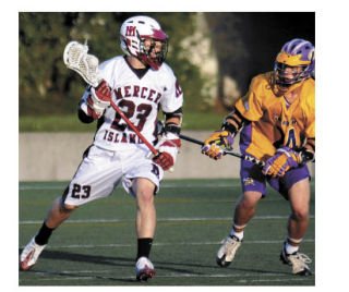 Steven Caditz tries to get around an Issaquah defender during the 2009 boys state lacrosse championships last Saturday. The Islanders lost the game 10-9.