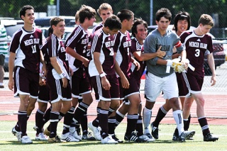 Islander teammates surround goalkeeper Forrest Marowitz