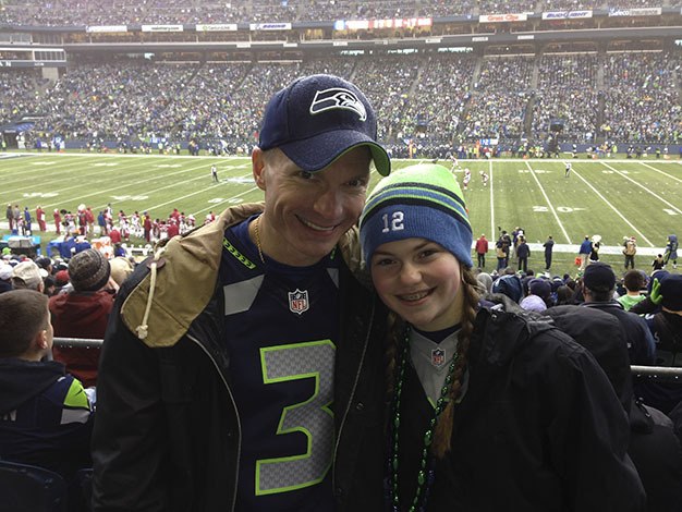 Mercer Island's Michael and Mackenzie Magnussen show off their Seahawk blue and green.