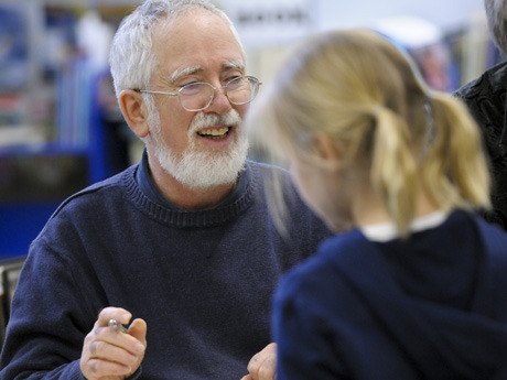 Children’s poet Jack Prelutsky signs books following an assembly last week at Lakeridge Elementary. The author