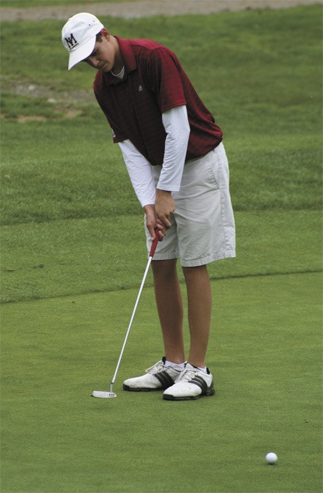 Mercer Island’s Charlie Kern putts the ball to the first hole last Tuesday afternoon at Wayne Golf Course in Bothell. The Islanders beat Juanita.