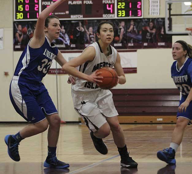 Mercer Island's Renae Tessem drives to the hoop against Liberty Wednesday