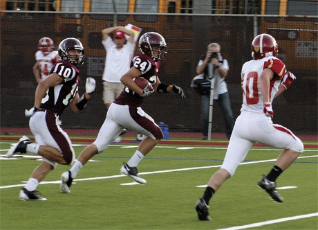 Mercer Island senior Erik Swedstedt (24) heads down field