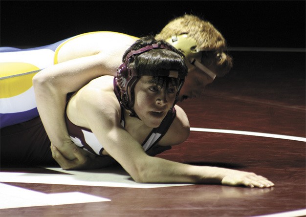 Mercer Island’s Dylan Sullivan beat Bellevue’s Andrew Ewing during the Islanders win last Friday over the Wolverines.