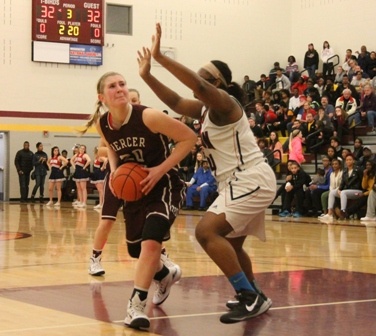 Mercer Island's Anna Luce fights for a shot against Wilson's Khaliyah Harris during the second half of the Islanders' 3A regional round matchup against the Rams Saturday