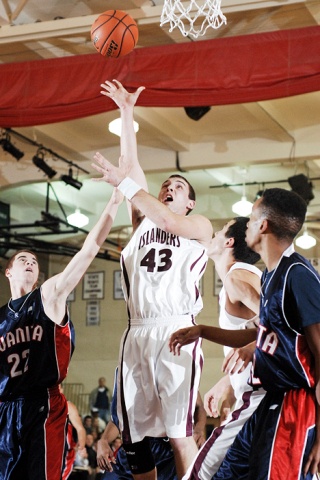 Islander Jon Poli scores two of his 14 points against Juanita.