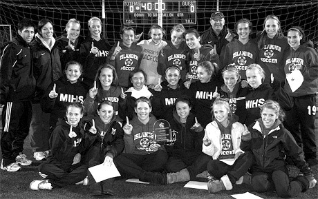 The MIHS girls soccer team celebrates after the KingCo trophy presentation during the conference tournament. The girls won the league for the first time since 2002.