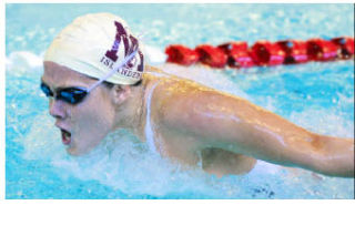 Islander Charlotte Graham swims in the 100-yard butterfly event against Newport at Mary Wayte Pool on Mercer Island