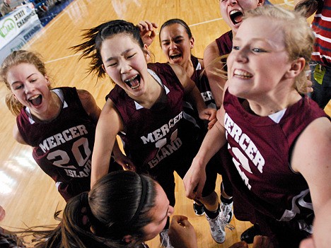 The Mercer Island girls basketball teams celebrates a come from behind 52-50 win over Kennedy Catholic at the Tacoma Dome on Thursday.