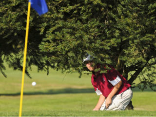 Islander Kirby Ingram watches his approach shot