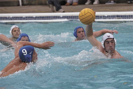 Mercer Island senior Kennen Adams makes a fast break down the pool during the Islanders’ win over Bellevue last Friday.