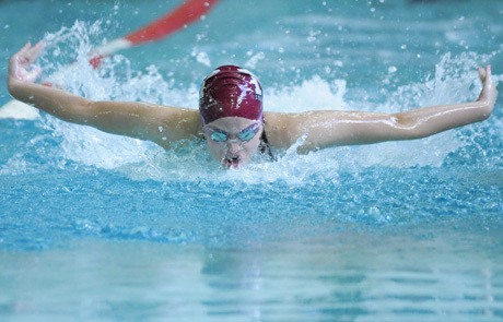 Islander Grace Wold competes in the 100-yard butterfly final at the KingCo conference championship swim meet at Mary Wayte Pool last Saturday.