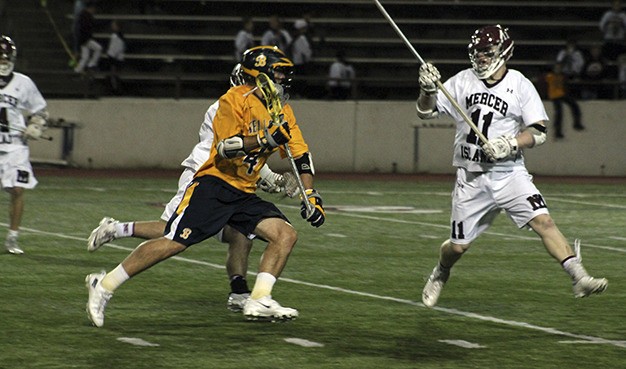 Mercer Island's Chase York (no. 11) defends against Bellevue's Eric Haehl Friday