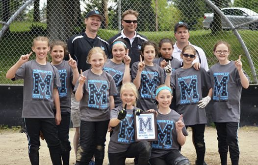 The Lady Sharks pose after going undefeated at the USSSA Mosquito Invite