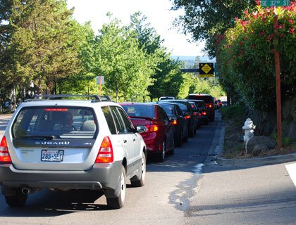 Cars headed toward the I-90 west onramp line up along Island Crest Way on Friday