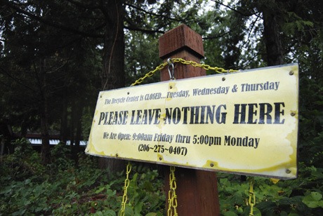 A Recycle Center sign reminds patrons not to leave trash while the center is closed.