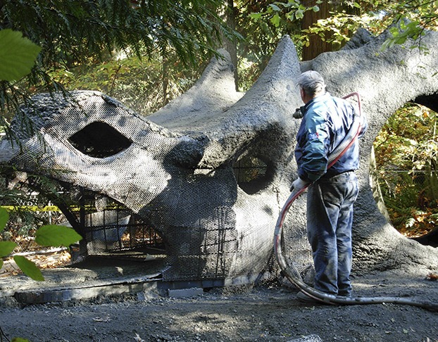 Cement is sprayed onto the mesh structure of the dragon early last week.