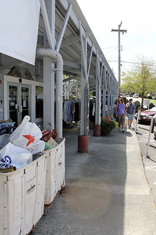 Sorting and handling donations is a big part of the work day at the Thrift Shop. Donations can spill onto the sidewalk.