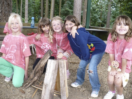 Brownie Girl Scouts learn how to place wood to build a camp fire. (From left to right) Anika Jansen