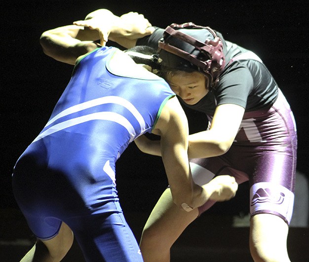 Mercer Island junior Ailin Fu wrestles Liberty's Dillon Ching Jan. 16 at Mercer Island High School.