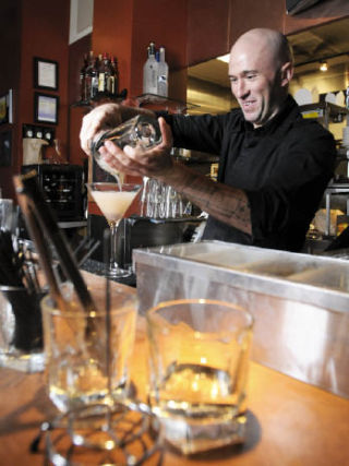 Bennett’s Pure Food Bistro bartender Roger Rookstool pours a custom drink on Mercer Island