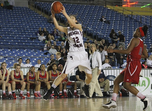 Rachael Tessem goes up to haul in a high pass during the 3A quarterfinal matchup Thursday