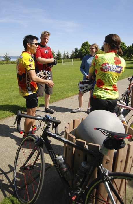 Cyclists meet last Sunday morning near the Park on the Lid at the westbound entrance to I-90. The sun and warm temperatures had many Islanders and visitors outside on Mother’s Day.