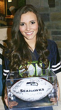 Mercer Island High School graduate Erin Crandall is offering a football signed by members of the Seattle Seahawks.