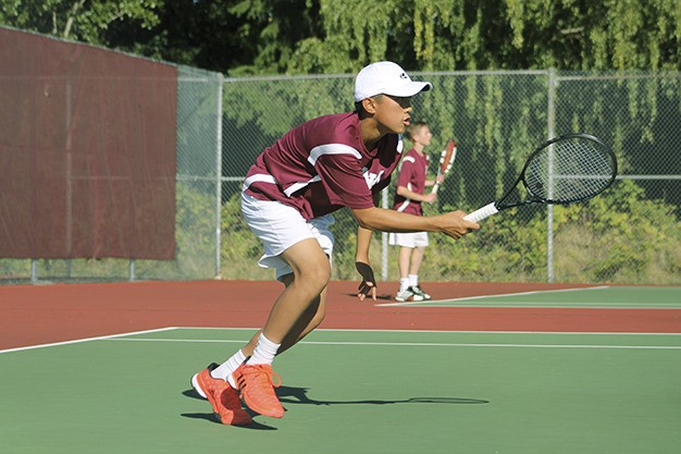 Mercer Island freshman Brandon Wong competes during his no. 1 singles match with Eastlake's Thiago Bandeira Wednesday at MIHS.