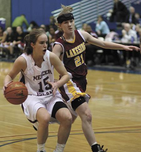 Mercer Island's Hailey Gullstad (15) tries to slow down as she faces the Lakeside defense in last week's game at the SeaKing district tournament. The Islanders won 77-51.