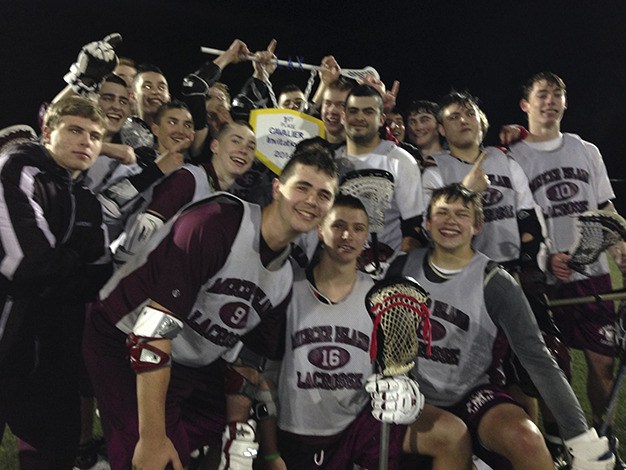 The Mercer Island JV lacrosse squad celebrates after winning the Cavalier Invitational tournament