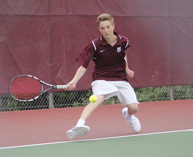 Mercer Island Chris Elliott competes against Lake Washington’s Aria Tabatabai Tuesday