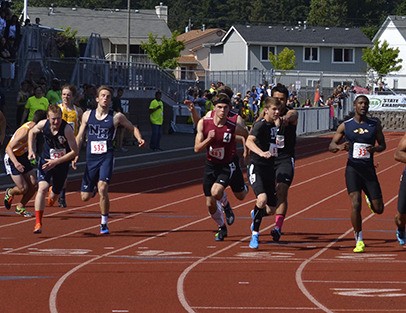 Mercer Island’s Eric Schulz (lane 4) competes in the 4x400 relay finals Saturday