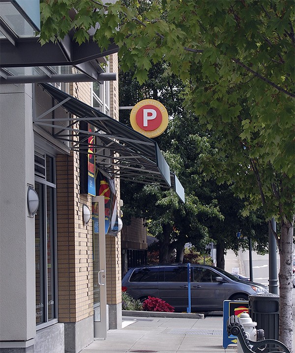 Signs pointing to parking in the Town Center aren’t very visible