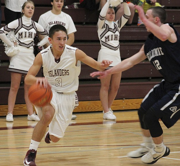 Mercer Island senior Daniel Sims drives to the basket during a 54-51 win against Bellarmine Prep Wednesday