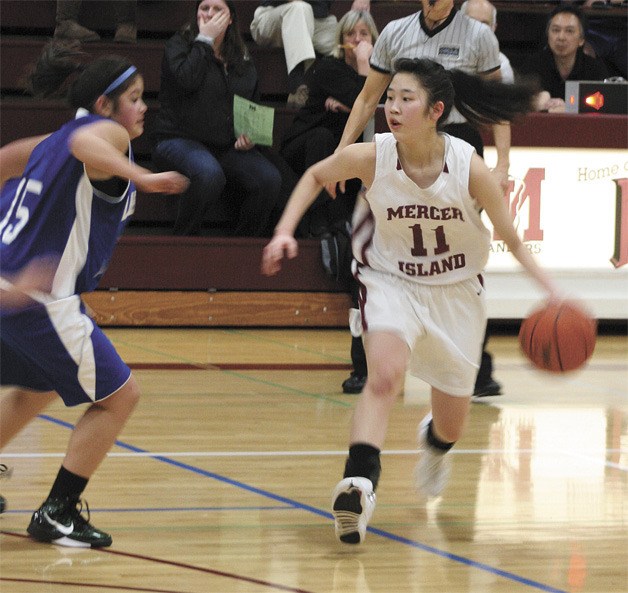 Mercer Island’s Jae Shin looks for an open teammate in the Islanders’ home defeat against Liberty last week. See sports scores on page 11 of this week’s issue.