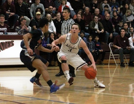 Mercer Island's Josh Stenberg (3) makes his move past Juanita's Randy Jones Friday