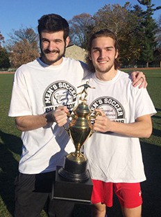 Islanders Sam Miller (left) and Ryan Hill (right) celebrate Haverford College's Centennial Conference Men's Soccer tournament championship win over Dickinson on Nov. 8th.