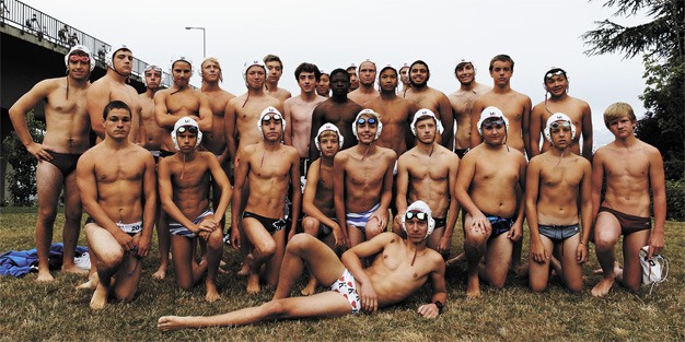 Members of the Mercer Island High School water polo team gathered near the Interstate 90 floating bridge before the annual lake swim at the beginning of the season.