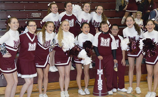 Mercer Island High School cheerleaders pose with their Sparkle counterparts at a recent event. Back row from left