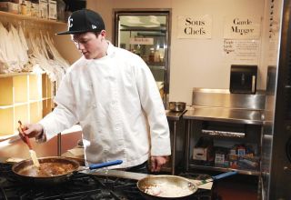 Chad Coleman/Mercer Island Reporter Mercer Island High School senior Kyle Connor prepares a dish in the culinary arts classroom at Newport High School in Bellevue as part of the NEVAC off-campus education program last Wednesday.