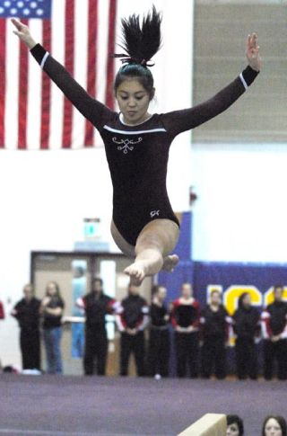 Chad Coleman/Mercer Island Reporter Islander Kristen Shibuya performs her beam routine at Issaquah High School Thursday.