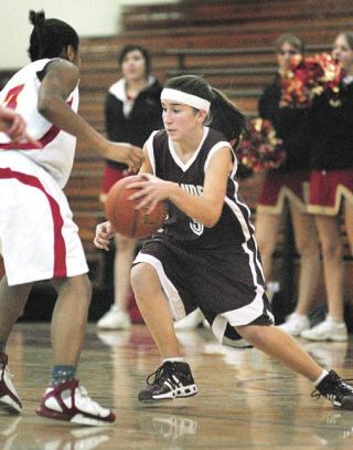 Chad Coleman/Mercer Island Reporter Islander Chloe Snethen drives against a Newport defender earlier this season.